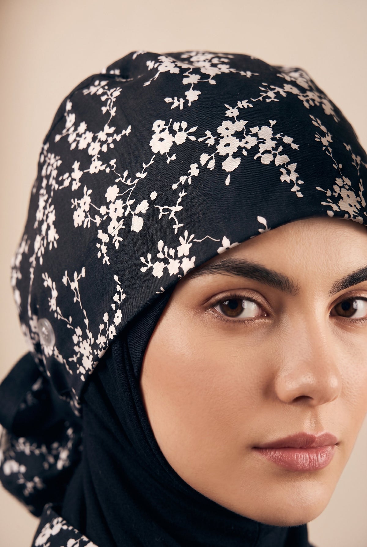 black with white floral pattern and black tie
