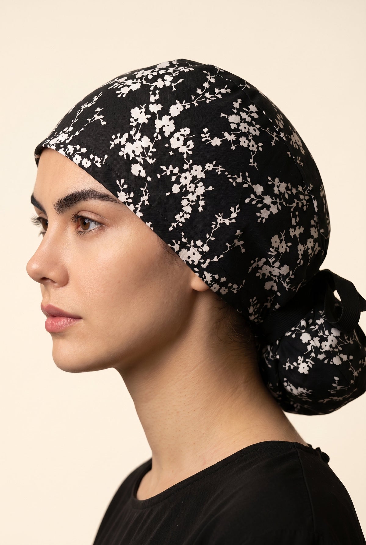 black with white floral pattern and black tie