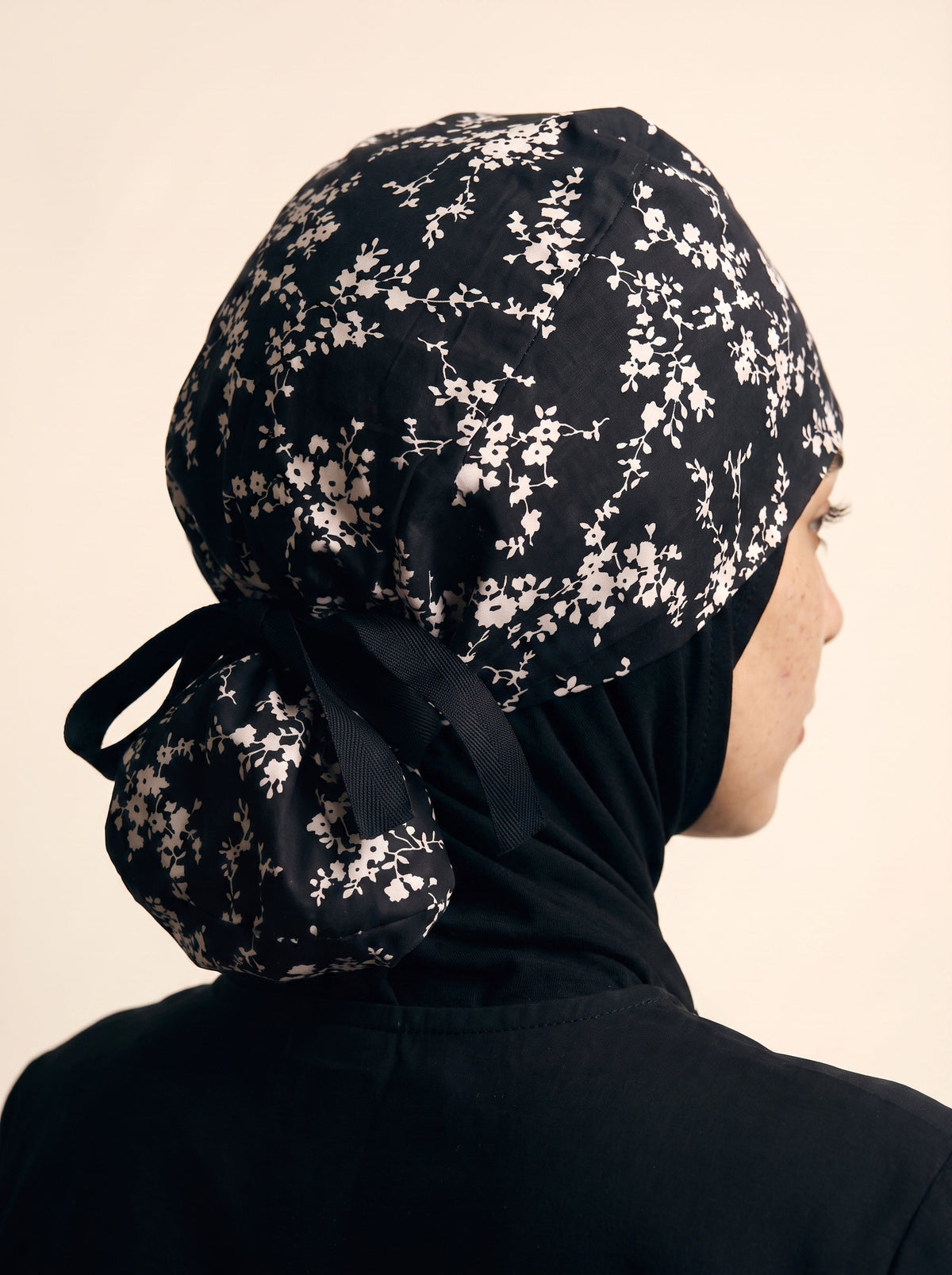 black with white floral pattern and black tie