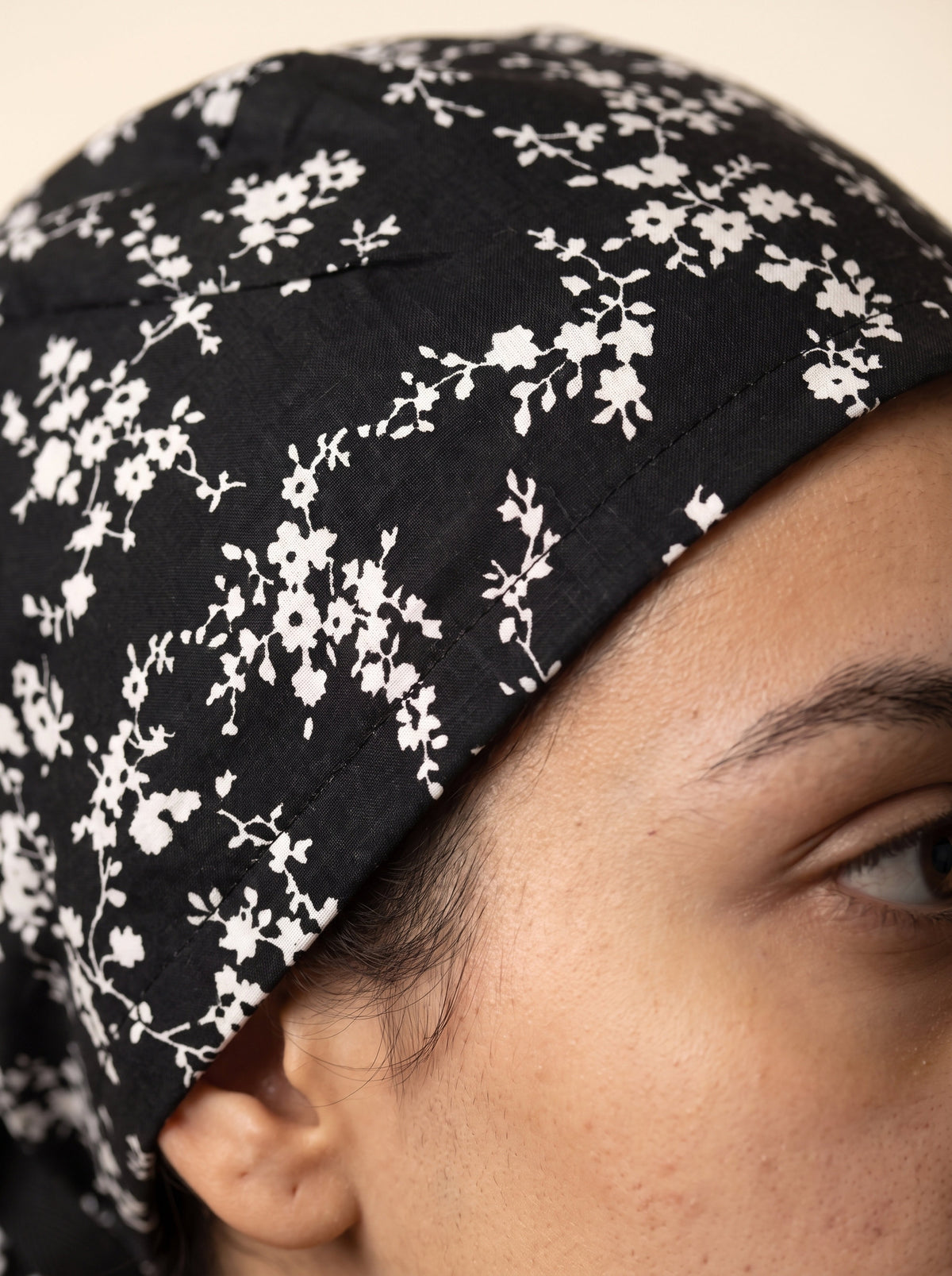 black with white floral pattern and black tie