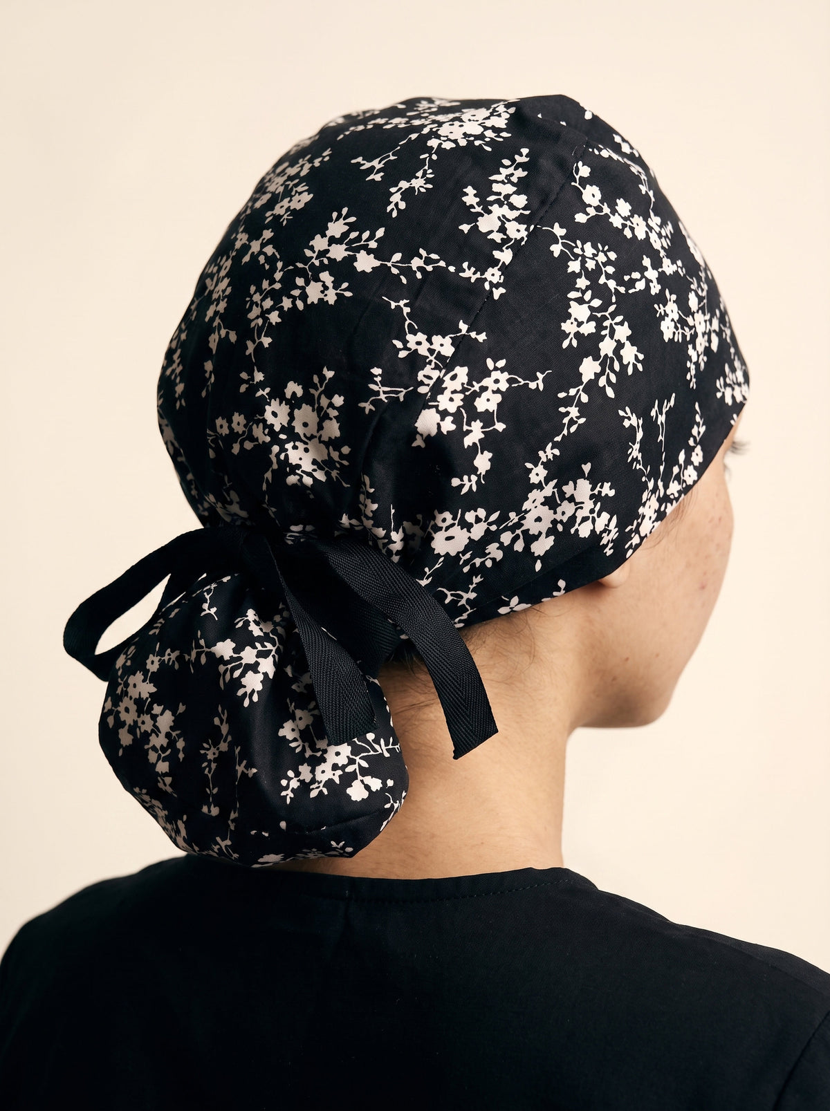 black with white floral pattern and black tie